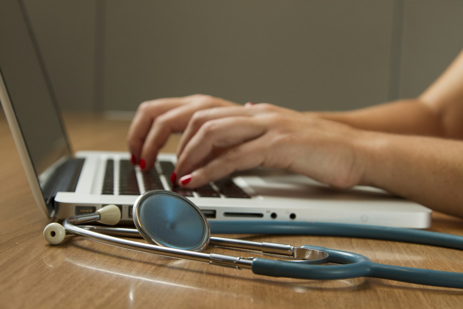 Clinician using a tablet in a consultation setting